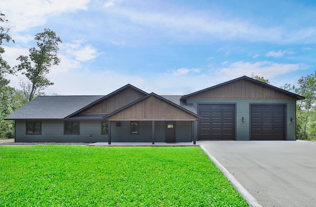 single story home featuring a front yard and a garage