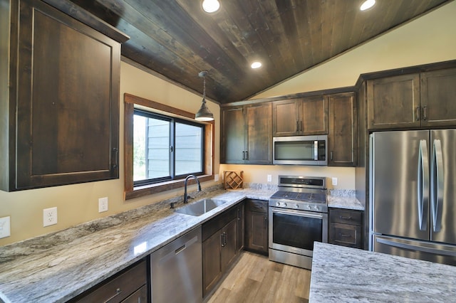 kitchen with sink, stainless steel appliances, wooden ceiling, light stone countertops, and vaulted ceiling