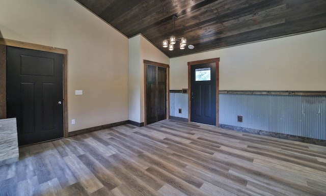 interior space with wood ceiling, lofted ceiling, and hardwood / wood-style flooring