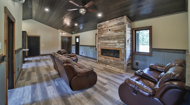 living room with wooden ceiling, a stone fireplace, vaulted ceiling, and hardwood / wood-style flooring