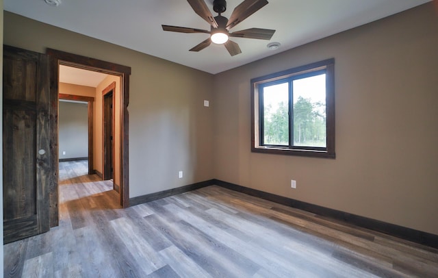 spare room with ceiling fan and hardwood / wood-style floors