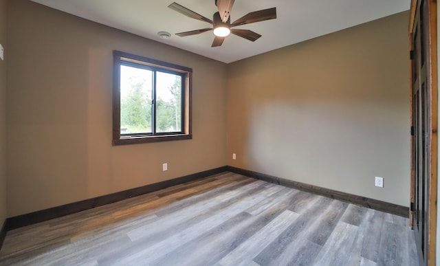 unfurnished room with ceiling fan and light hardwood / wood-style floors