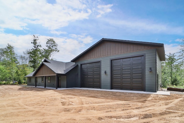 garage featuring wooden walls