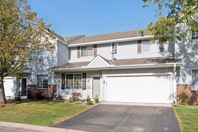 view of front facade featuring a front lawn and a garage