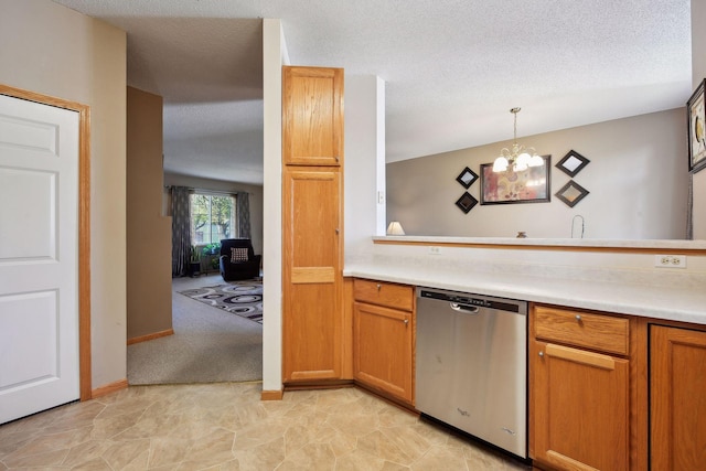 kitchen with a textured ceiling, pendant lighting, an inviting chandelier, and dishwasher