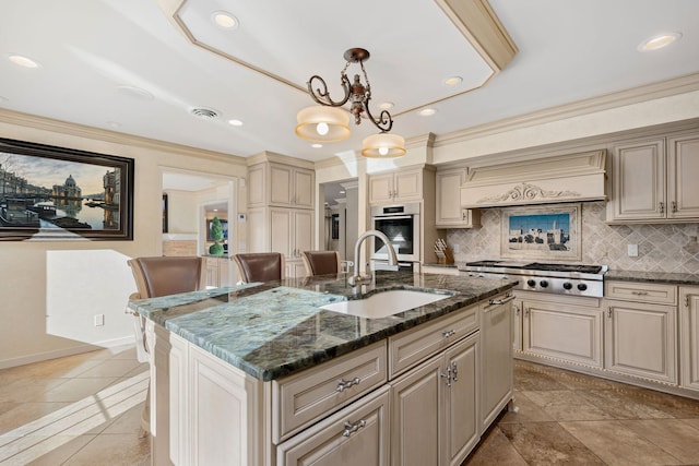 301 22nd St NW, Austin, MN 55912 - kitchen featuring cream cabinets, a sink, appliances with stainless steel finishes, premium range hood, and decorative backsplash