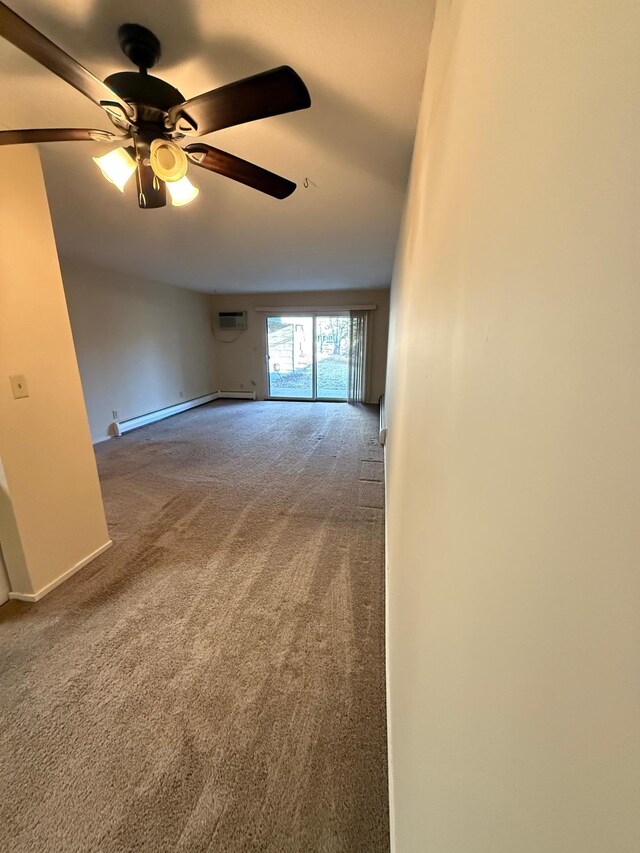 2800 Hamline Ave N Unit 112, Roseville, MN 55113 - spare room featuring baseboard heating, carpet, a ceiling fan, and an AC wall unit