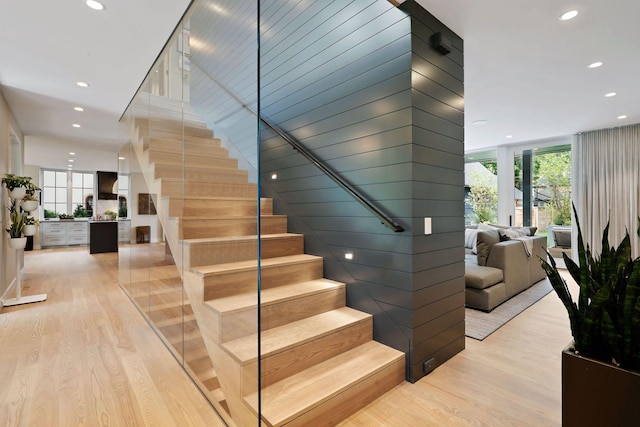 stairs with hardwood / wood-style flooring