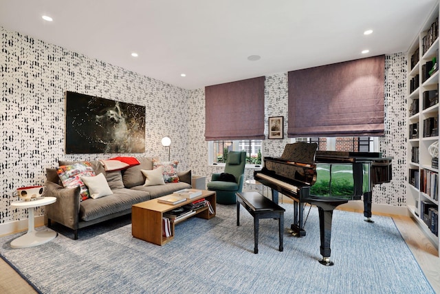 living area featuring wood-type flooring and plenty of natural light