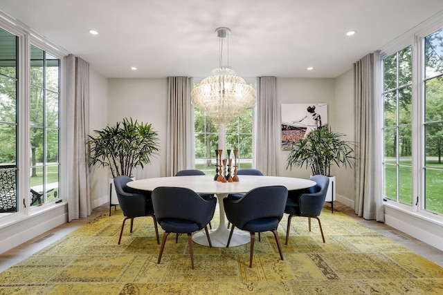 dining room featuring a chandelier and light hardwood / wood-style flooring