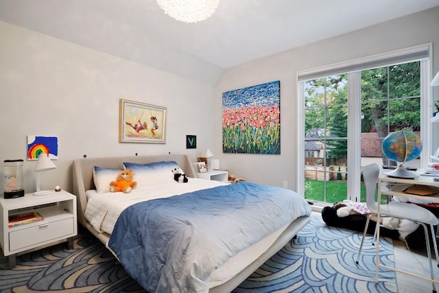 bedroom featuring vaulted ceiling