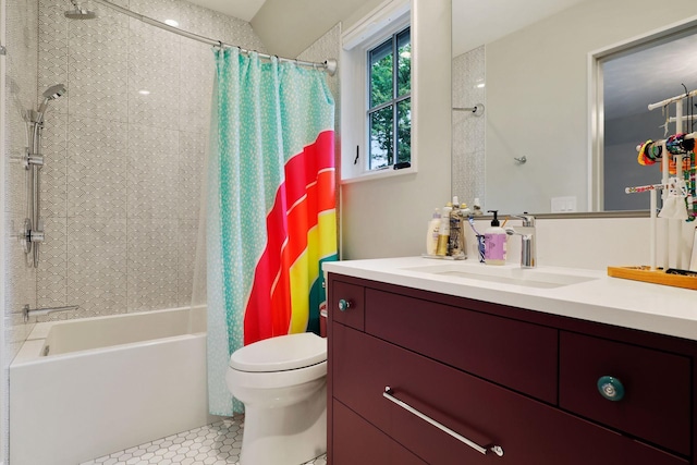 full bathroom with tile patterned floors, shower / bath combo, vanity, and toilet