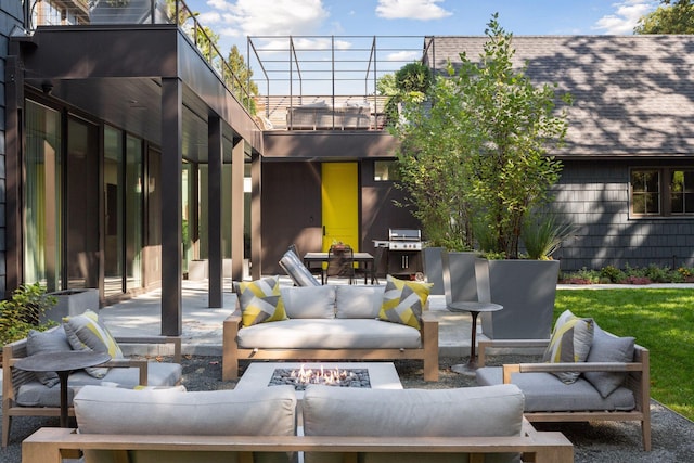 view of patio / terrace with a balcony and an outdoor living space