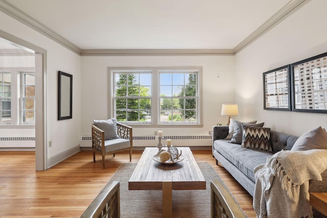 living room with crown molding, light hardwood / wood-style floors, and radiator heating unit