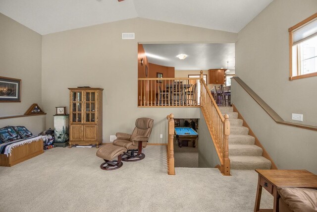 interior space featuring light carpet and lofted ceiling