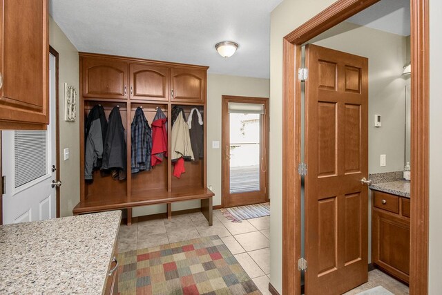 mudroom featuring light tile patterned floors