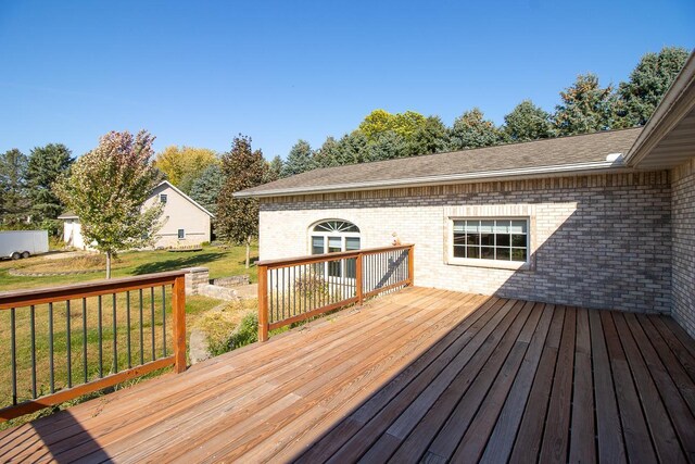 deck featuring a lawn