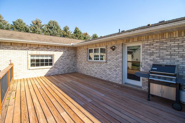 wooden deck featuring grilling area