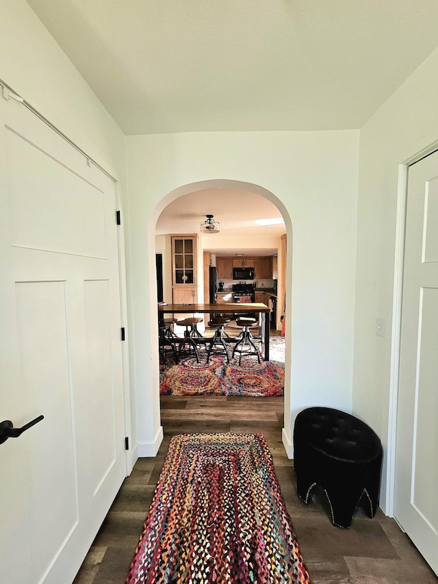 hallway featuring dark wood-type flooring