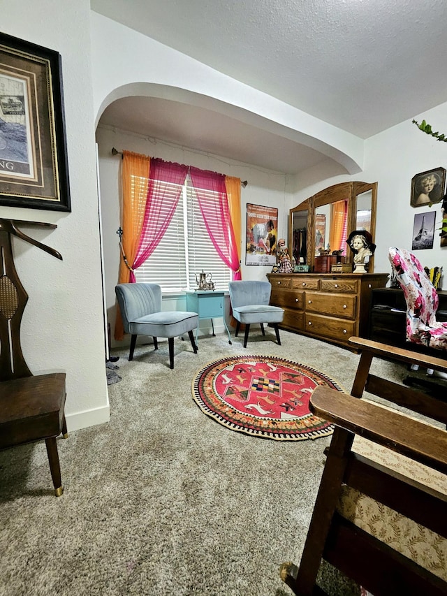 bedroom featuring a textured ceiling and carpet flooring