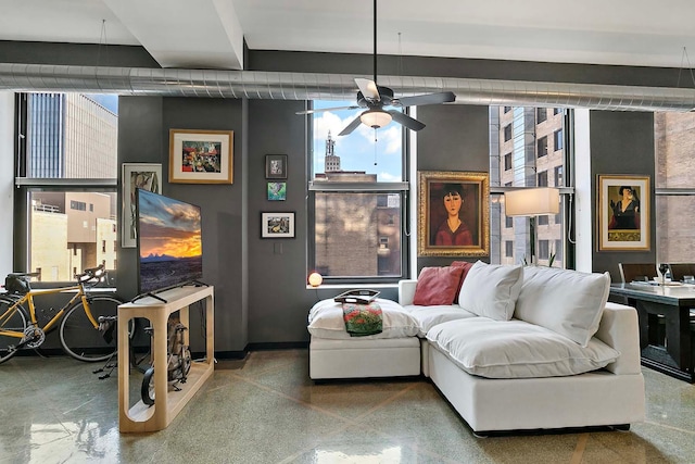 living room with a wealth of natural light and ceiling fan