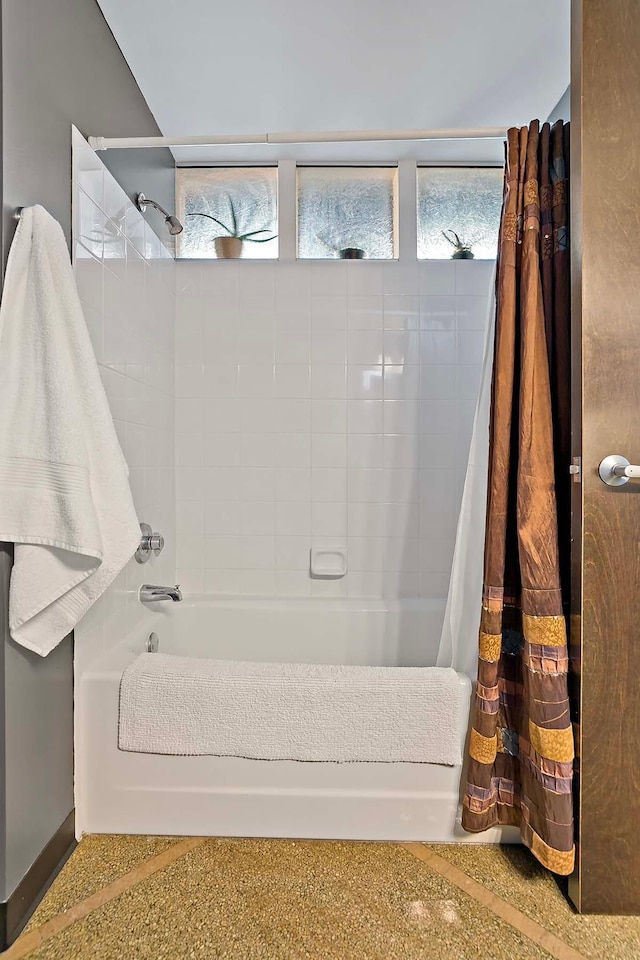 bathroom with shower / tub combo