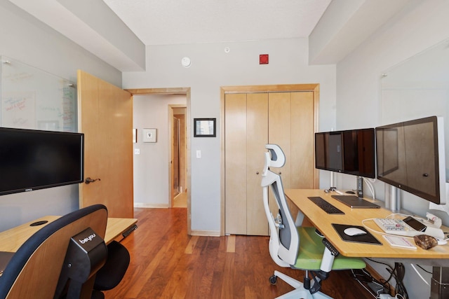 office with dark wood-type flooring