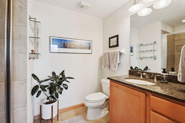 full bath featuring baseboards, tiled shower, toilet, tile patterned floors, and vanity