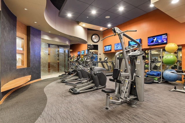 exercise room with carpet flooring and recessed lighting