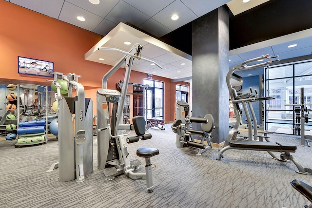 exercise room featuring recessed lighting and carpet flooring