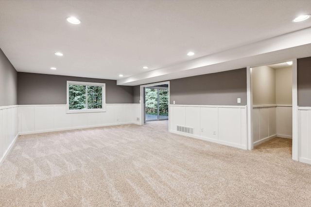 basement with light carpet