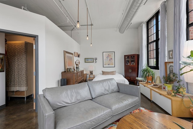 living room featuring a high ceiling