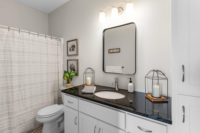 bathroom with vanity, toilet, and tile patterned floors