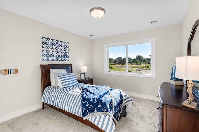 bedroom with light colored carpet