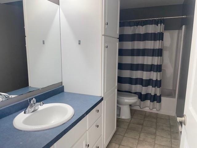 full bathroom with vanity, toilet, and shower / bath combo with shower curtain