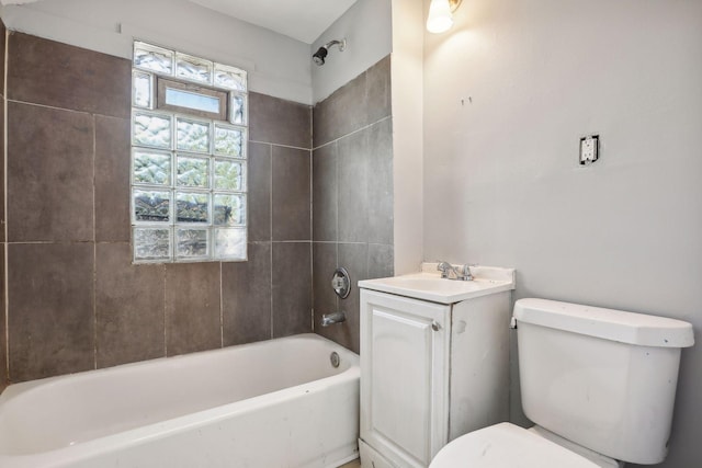 bathroom featuring toilet, bathing tub / shower combination, and vanity