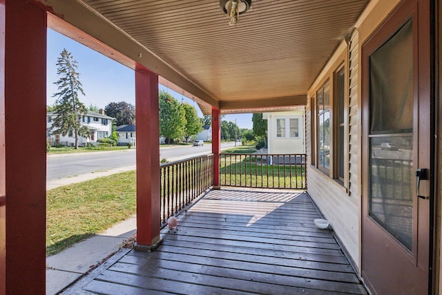 wooden terrace featuring covered porch