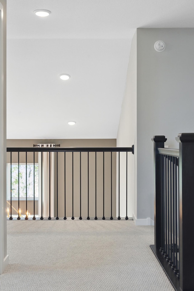 staircase with carpet floors