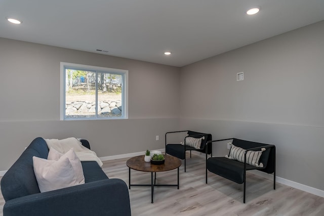 sitting room with light hardwood / wood-style floors