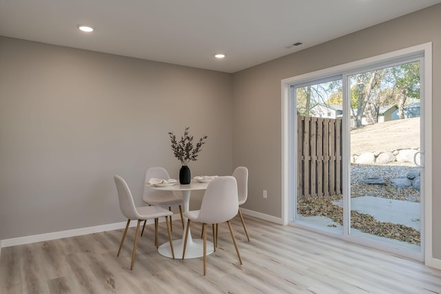 dining room featuring light hardwood / wood-style flooring