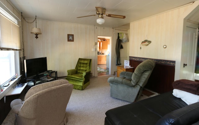 living room featuring carpet and ceiling fan