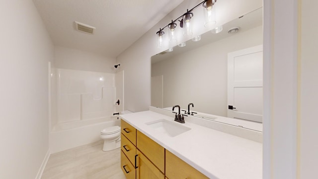 full bathroom with  shower combination, vanity, and toilet