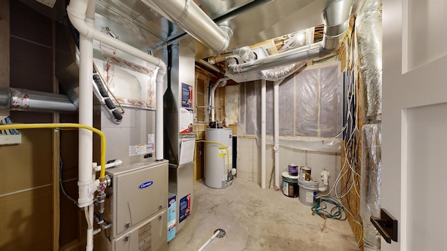 utility room featuring water heater