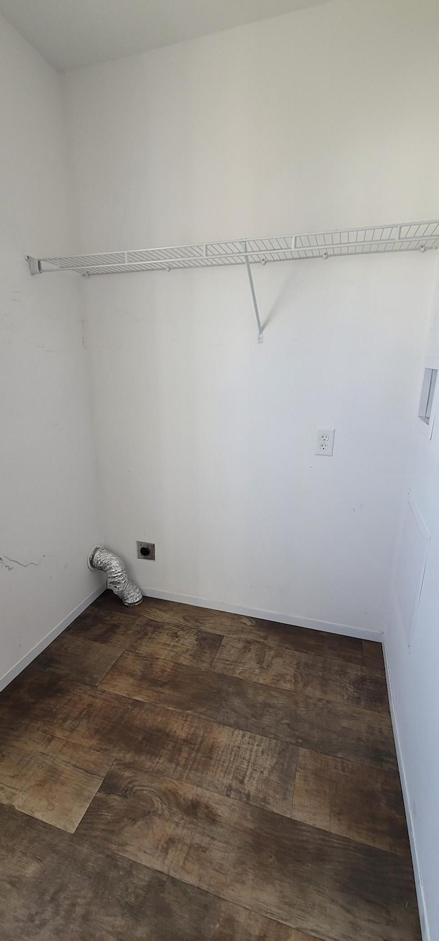 clothes washing area with baseboards, laundry area, wood finished floors, and hookup for an electric dryer