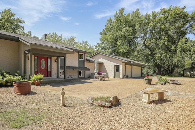 back of house featuring a patio