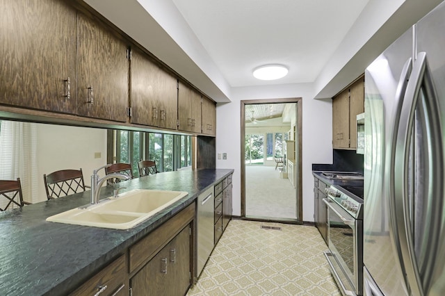 kitchen featuring stainless steel appliances and sink