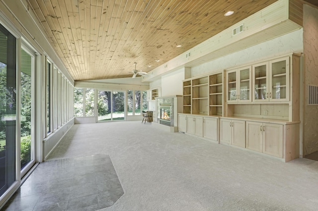 unfurnished sunroom with plenty of natural light, vaulted ceiling, and wooden ceiling