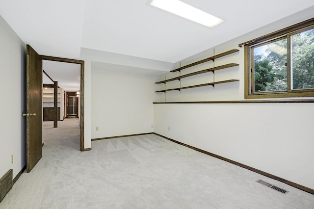 empty room with light colored carpet