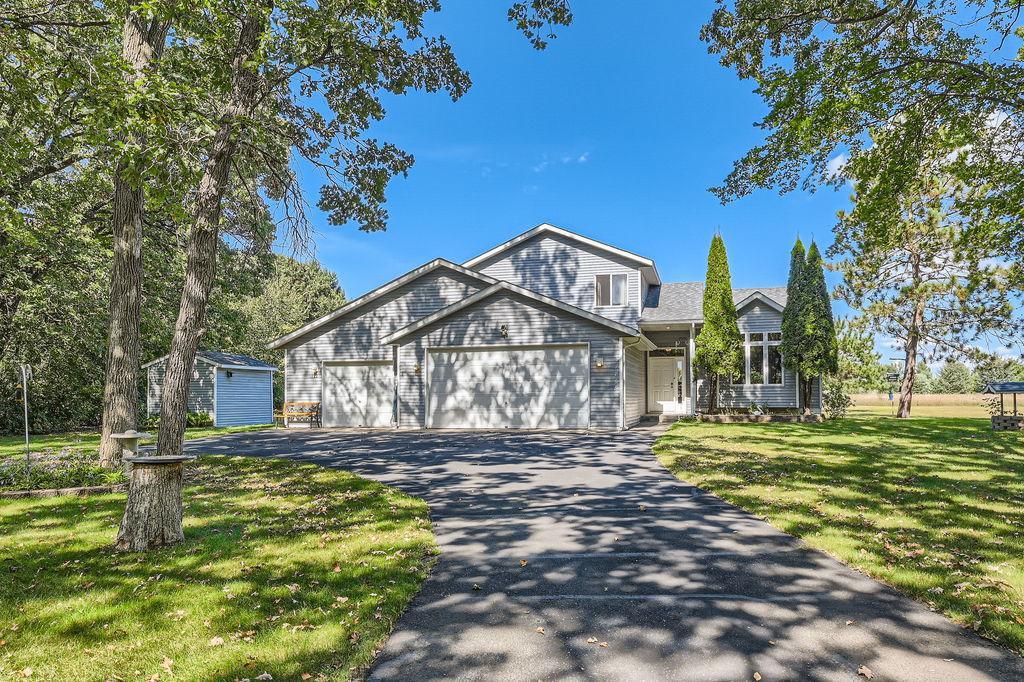 view of front of house featuring a garage and a front lawn