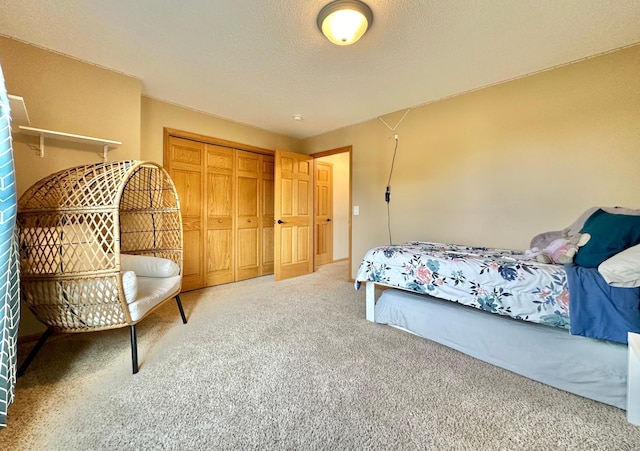 carpeted bedroom featuring a closet